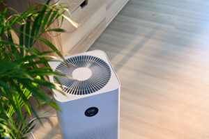 Air purifier on wooden floor in comfortable home Fresh air and